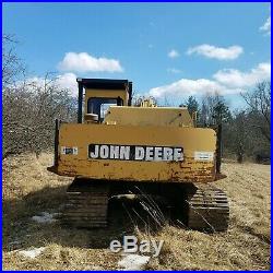 1995 John Deere 590D Excavator, great condition, coupler, hydraulic thumb guards