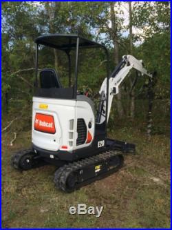 BOBCAT E20 MINI EXCAVATOR WITH AUGER, BUCKET AND HYDRAULIC THUMB IMPLEMENTS NEW