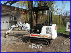Bobcat 320 track mini excavator with blade and bucket