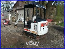 Bobcat 320 track mini excavator with blade and bucket