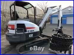 Bobcat E32 mini excavator with hydraulic thumb and a second set of new tracks