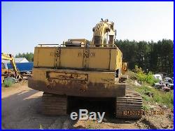 Cat 235B excavator with grapple