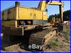 Cat 235B excavator with grapple