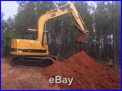 Caterpillar E70B excavator with thumb