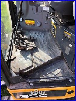 Mini Excavator John Deere 35g with blade and thumb. Cab with heat and a/c